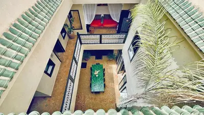 an overhead view of a building with a clock at Riad Kadi in Marrakech