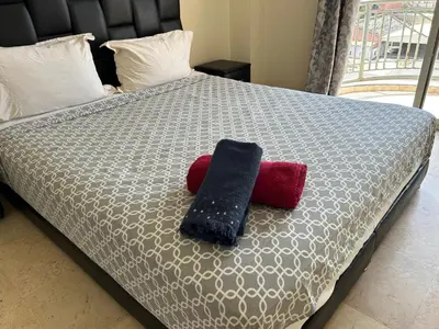 a bed with two pillows on top of it at Appartement 33 in Marrakech