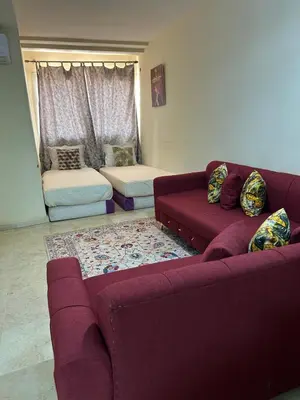a living room with two couches and a couch at Appartement 33 in Marrakech