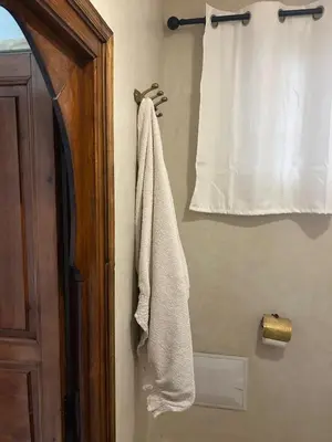 a towel hanging on a wall next to a door at Riad Couleurs du Sud in Marrakech
