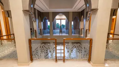 a room with a staircase and a mirror at Mimouna Riads in Marrakech