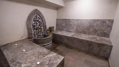 a room with two stone benches in a room at Mimouna Riads in Marrakech
