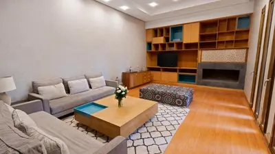 a living room with a couch and a coffee table at Mimouna Riads in Marrakech