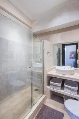 a bathroom with a shower and a sink at Villa Cosy - Jardin de l'Atlas - Golf & Waky in Marrakech
