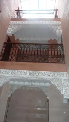 a building with a gate and a balcony at Hotel Aday in Marrakech