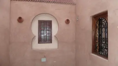 a window on the side of a building with a window at Hotel Aday in Marrakech