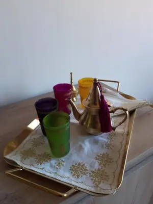a tray with a tea kettle and cups on a table at Jade Golf City in Marrakech