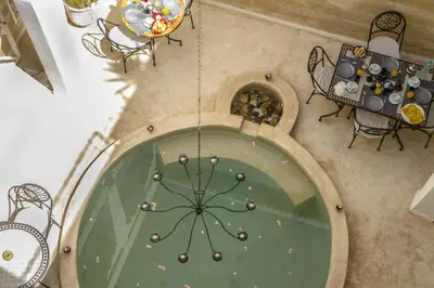 an overhead view of a room with a table and chairs at Riad THALGE in Marrakech