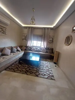 a living room with a couch and a window at Marrakesh home in Marrakech