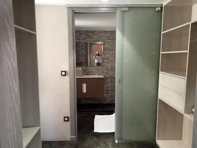 a person taking a picture in a bathroom mirror at Medina Loft & Spa in Marrakech
