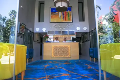 a restaurant with a blue and yellow carpet at Medina Loft & Spa in Marrakech