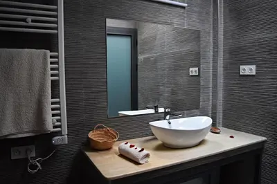 a bathroom with a sink and a mirror at Riad Dar DARRE in Marrakech