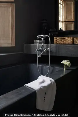 a bathroom with a shower with a towel on a counter at Dar Seven in Marrakech