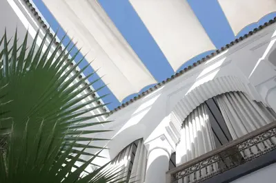 a ceiling in a building with a plant at Dar Seven in Marrakech