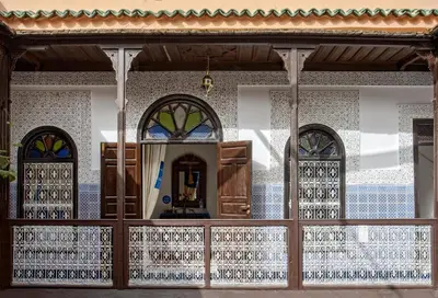 a front window of a church with stained glass at Riad Al Jana in Marrakech