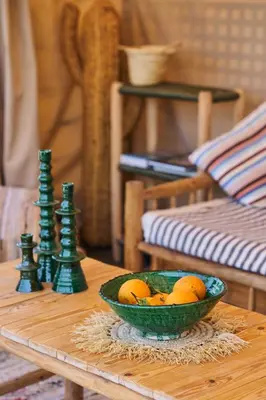 a bowl of oranges on a table next to a bowl of chess at Riad Miloud en exclusivité 10 P au cœur de la Médina in Marrakech