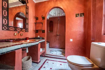 a bathroom with a toilet and a sink and a shower at Riad Adilah Marrakech - by EMERALD STAY in Marrakech
