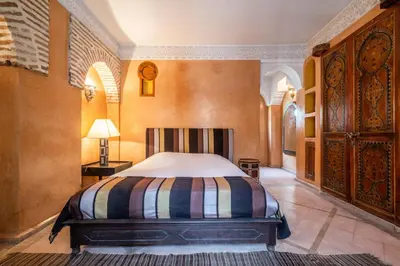 a bedroom with a large bed in a room at Riad Adilah Marrakech - by EMERALD STAY in Marrakech