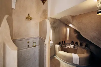 a bathroom with a sink and a bath tub at Riad Spice by Marrakech Riad in Marrakech