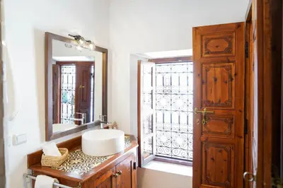 a bathroom with a sink and a mirror at Riad NayaNour in Marrakech