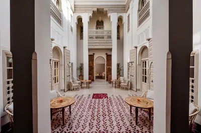 a view of the lobby of a hotel with two tables at Riad 72 in Marrakech
