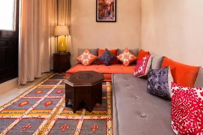 a living room with a couch and a table at RIAD AZRUR in Marrakech