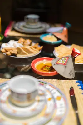 a table with plates of food on it at RIAD AZRUR in Marrakech