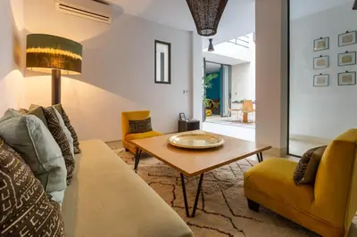 a living room with a couch and a table at Douiria13 in Marrakech