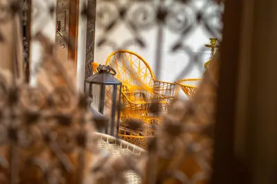a table and chairs in a room with a window at Medina Sun in Marrakech