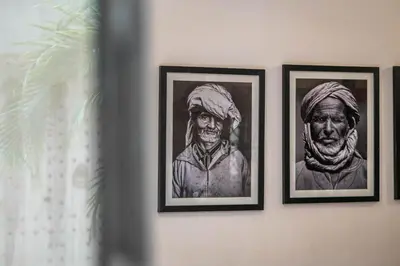 three framed pictures of a man on a wall at Medina Sun in Marrakech