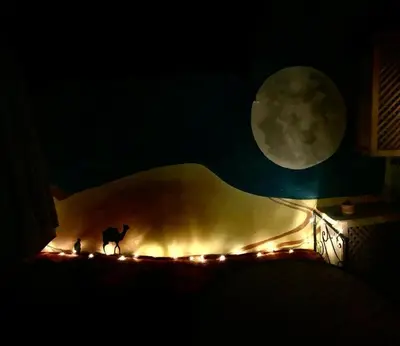 a fire place with a cat standing in the dark at Terrace House in Marrakech