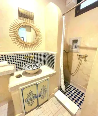 a bathroom with a sink and a mirror at Riad Beata Bed & Breakfast in Marrakech