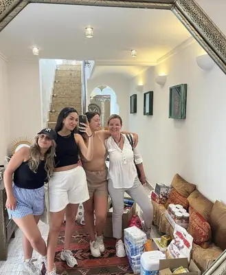 a group of women standing in a living room at Riad Beata Bed & Breakfast in Marrakech