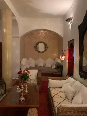 a living room with a couch and a table at Riad Dar Kasal in Marrakech