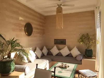 a living room with a couch and a table at Riad Dar Kasal in Marrakech