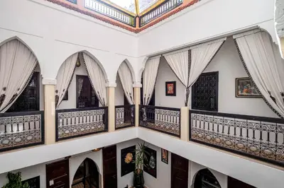 an ornate staircase in a house with a ceiling at RIAD LA GAZELLE DU SUD in Marrakech