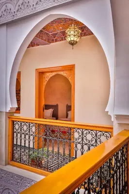 a staircase in a house with a balcony at RIAD VILLA SIDI BABA in Marrakech