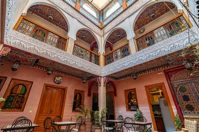 an ornate building with tables and chairs at RIAD VILLA SIDI BABA in Marrakech