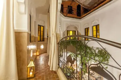 a staircase in a building with a clock on it at Riad Hart Essoura in Marrakech