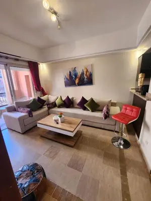 a living room with a couch and a table at Appartement Patio centre Gueliz in Marrakech