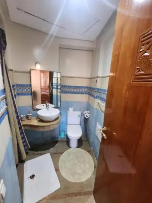 a bathroom with a toilet and a sink at Appartement Patio centre Gueliz in Marrakech