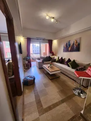 a living room with a couch and a table at Appartement Patio centre Gueliz in Marrakech