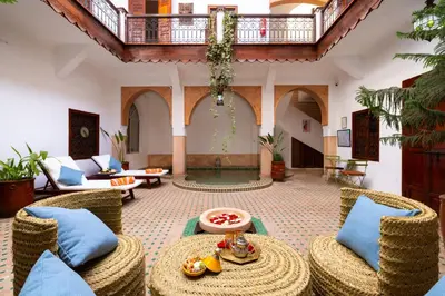 a living room with chairs and a table at Riad Saba in Marrakech
