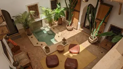 an overhead view of a living room with plants at Riad Dar Eternity in Marrakech
