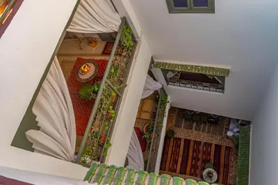 an overhead view of a house with a mirror at Riad dar El Arsa Rooftop & jacuzzi in Marrakech