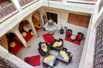 an overhead view of a living room with tables and chairs at Riad La Kahana in Marrakech