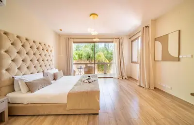 a large bedroom with a large bed and a large window at Villa White High-Standing - Breakfast in Marrakech