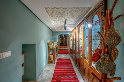 a hallway with red carpets on the floors and walls at Riad Janate & SPA in Marrakech