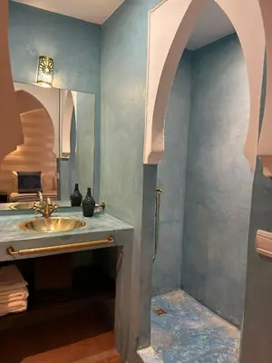 a bathroom with a sink and a mirror at Riad ANYSSA in Marrakech