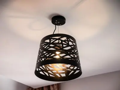 a black light fixture hanging from a ceiling at Coup de cœur à Marrakech - idéal famille et couple in Marrakech